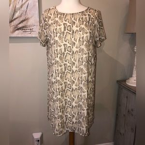 This is an off white shift dress with a snake skin print.  Size L